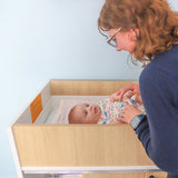Whitney Brothers elevatED Infant Changing Cabinet Classroom Changing Cabinet - open storage view for diapering supplies