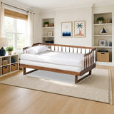 Baxton Studio Muriel Modern and Transitional Walnut Finished Wood Expandable Twin Size to King Size Spindle Daybed styled in a bright kids' bedroom, Walnut