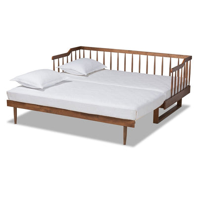 Wooden bed frame with white mattress and pillows on a white background