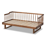 Wooden daybed with slatted bed platform on a white background
