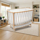 Charlie Crane KIMI Baby Bed styled in a bright nursery-style kids' room, shown finish