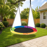 Costway 40 Inch Flying Saucer Tree Swing Outdoor Play for Kids styled in a sunny backyard, shown finish