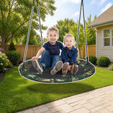 Costway 40-Inch Flying Saucer Tree Swing Outdoor Play Set with Adjustable Ropes Gift for Kids styled in a sunny backyard, shown finish