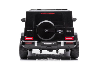 24V black Mercedes Benz G63 AMG 4x4 ride-on car for kids, featuring a realistic luxury SUV design, two seats, LED lights, working doors, and all-terrain wheels.