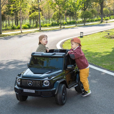 24V black Mercedes Benz G63 AMG 4x4 ride-on car for kids, featuring a realistic luxury SUV design, two seats, LED lights, working doors, and all-terrain wheels.