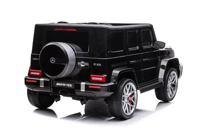 24V black Mercedes Benz G63 AMG 4x4 ride-on car for kids, featuring a realistic luxury SUV design, two seats, LED lights, working doors, and all-terrain wheels.