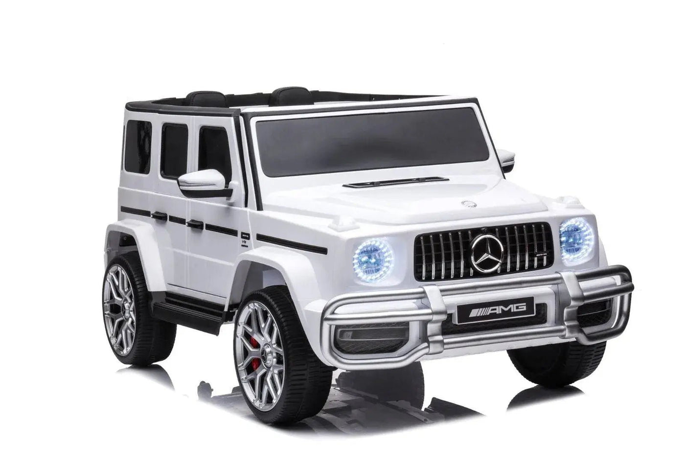 24V white Mercedes Benz G63 AMG 4x4 ride-on car for kids, featuring a realistic luxury SUV design, two seats, LED lights, working doors, and all-terrain wheels.