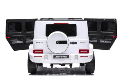 24V white Mercedes Benz G63 AMG 4x4 ride-on car for kids, featuring a realistic luxury SUV design, two seats, LED lights, working doors, and all-terrain wheels.