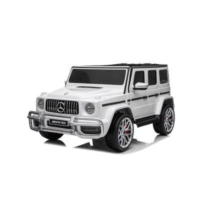 24V white Mercedes Benz G63 AMG 4x4 ride-on car for kids, featuring a realistic luxury SUV design, two seats, LED lights, working doors, and all-terrain wheels.