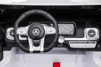 24V white Mercedes Benz G63 AMG 4x4 ride-on car for kids, featuring a realistic luxury SUV design, two seats, LED lights, working doors, and all-terrain wheels.