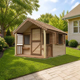 Playhouse Factory Little Alexandra Cottage (8 ft. x 6 ft.) with covered front porch styled in a sunny backyard, shown finish