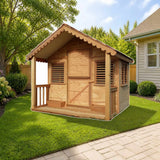Playhouse Factory Little Alexandra Cottage with front porch (6ft x 6ft) styled in a sunny backyard, shown finish