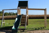 Rustic cedar log playground tower with monkey bars, slide, and swings for outdoor play