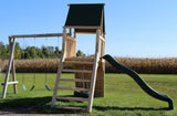 Rustic cedar log playground with swings, slide, and tire swing for kids.