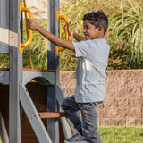 Jack & June Haven II wooden swing set with slide, rock wall, and two belt swings for backyard outdoor play