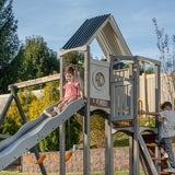 Jack & June Haven II wooden swing set with slide, rock wall, and two belt swings for backyard outdoor play
