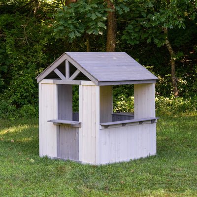 Jack & June wooden outdoor playhouse for kids with windows, door, and porch – ideal backyard play structure for imaginative play.