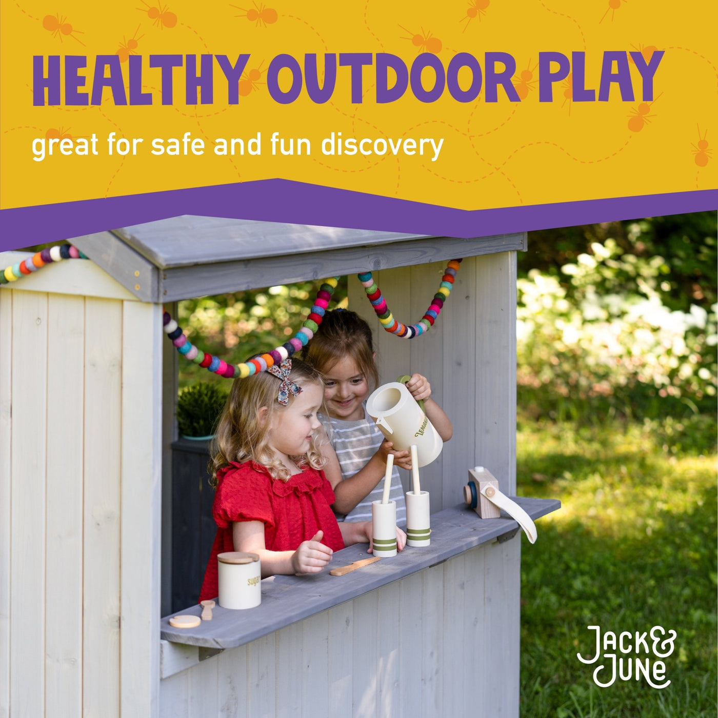 Jack & June wooden outdoor playhouse for kids with windows, door, and porch – ideal backyard play structure for imaginative play.