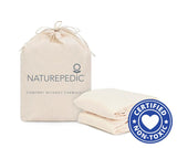 Naturepedic Organic Waterproof Protector Pad on bed – breathable, GOTS certified organic cotton mattress protector for babies and adults.